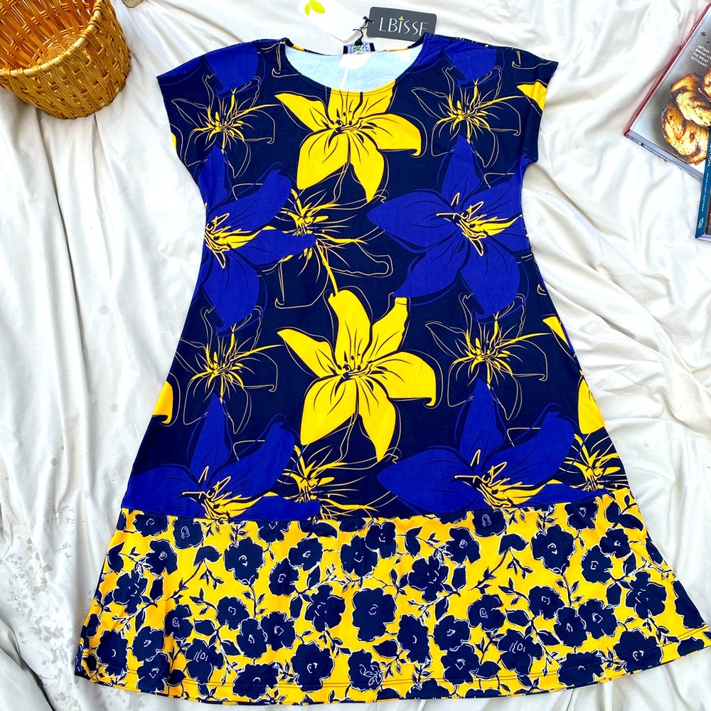 Cute flower dress. Knee length.Flattering fit and style.Blue with yellow flowers